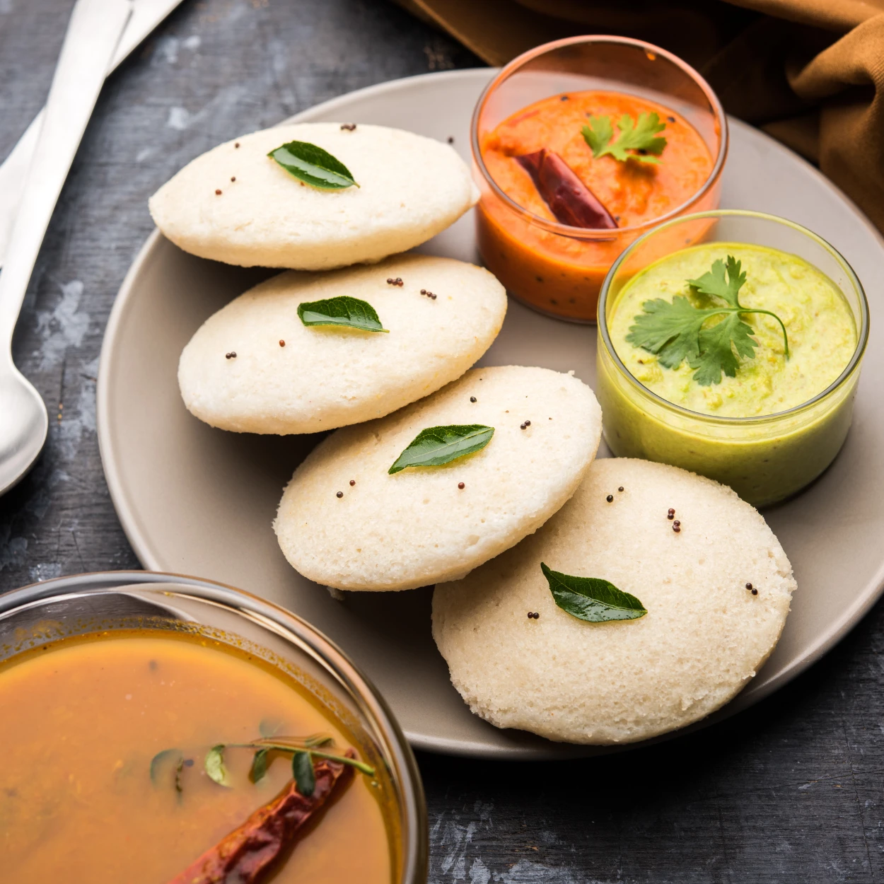 a delicious idli plate with sambar